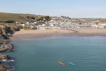 Kayaks in a picturesque bay