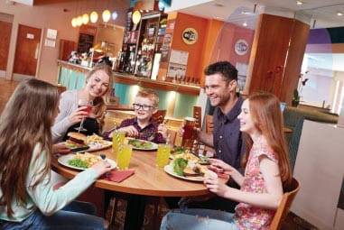 a family enjoying dinner together in the restaurant