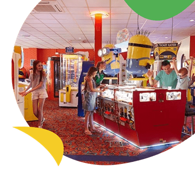 Family enjoy amusement arcade at Cherry Tree Holiday Park
