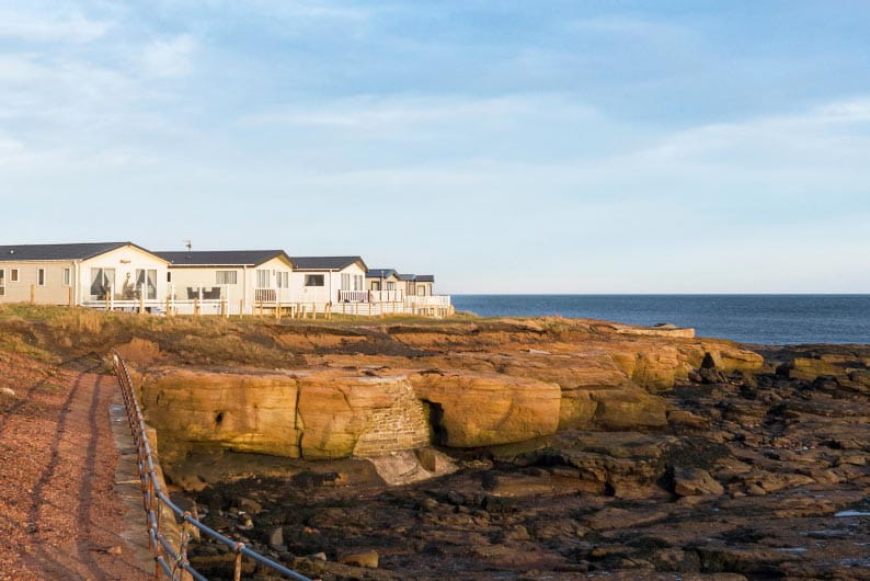 White house coastal village on a cliff edge by the sea