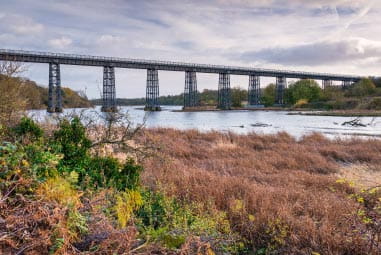 Long iron bridge over a river