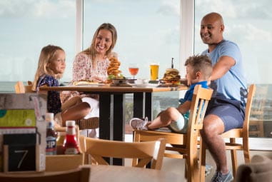 Family enjoying a meal at a restaurant