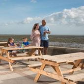 Family enjoying a coastal view