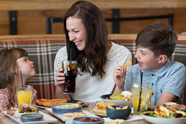 A family enjoying a meal in the restaurant