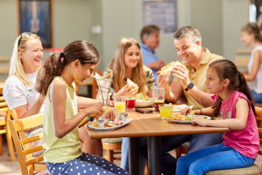 A family enjoying a meal at a restaurant