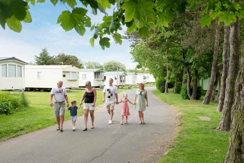 a family taking a stroll through the park