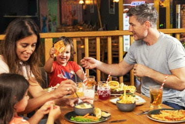 a family enjoying a meal at the restaurant