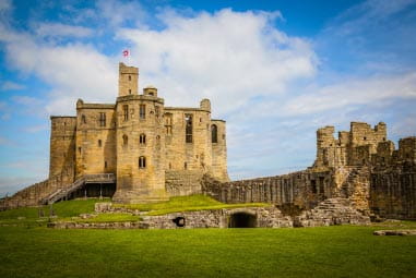 an ancient castle surrounded by countyside
