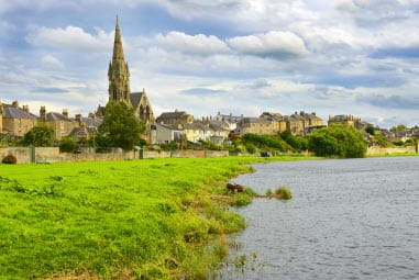 Quaint town with church amongst greenery