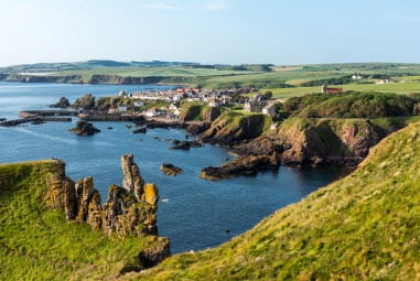 Clifftop town bordered by blue sea