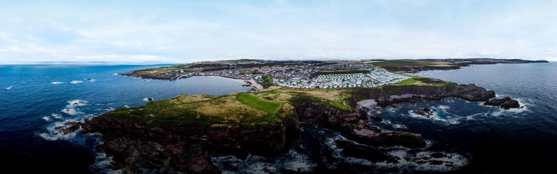 View of a stunning coastal cliff bordering the sea