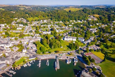 a town nestled amongst green fields and trees