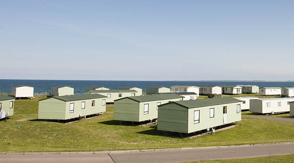 Caravans with a sea view at Grannie's Heilan' Hame Holiday Park