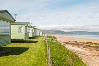 caravans facing the beach and the sea