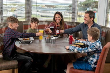A family enjoying a meal at a restaurant