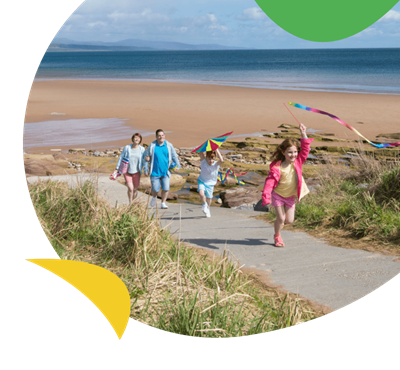 Family at the beach at Grannies Heilan Hame holiday park