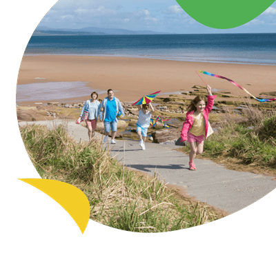 Family at the beach at Grannies Heilan Hame holiday park