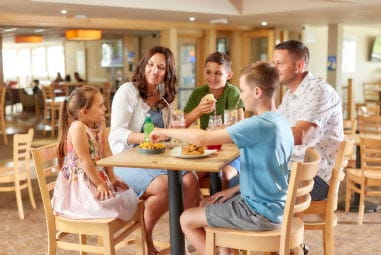 a family enjoying a meal at the restaurant