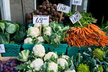 vegetables on a market stall outside