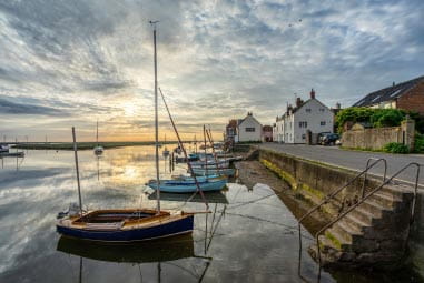 Wells next to the sea at sunset
