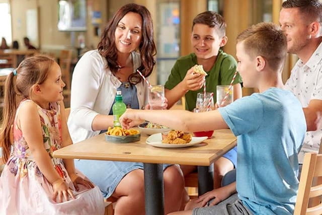 family enjoying a meal in the restaurant