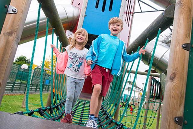 Kids playing on the adventure playground