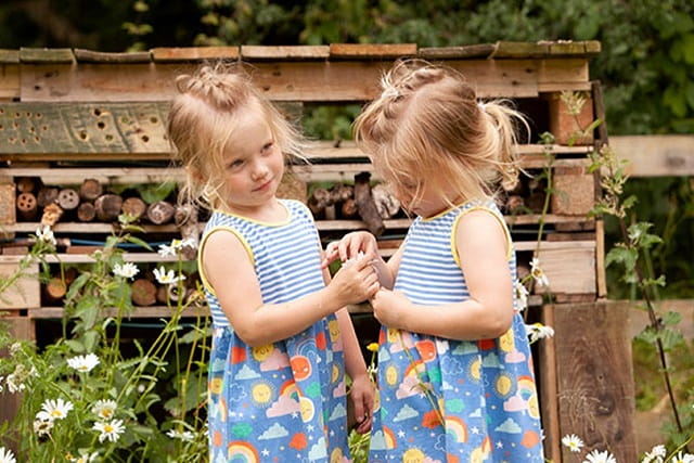 two young girls holding hands