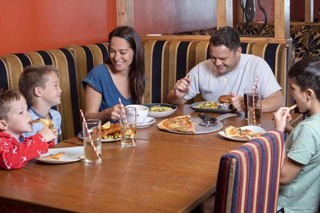 family enjoying a meal in a restaurant