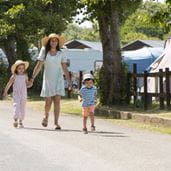 a family strolling through a holiday park