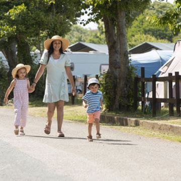 a family strolling through a holiday park