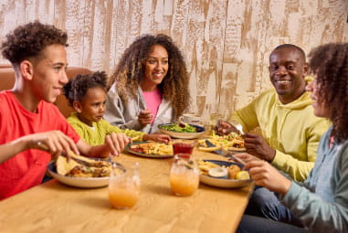 a family enjoying a meal at the restaurant