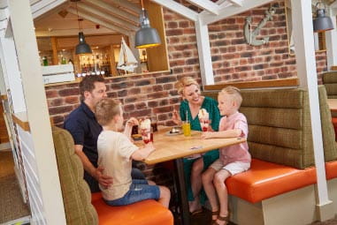 A family enjoying ice cream at a restaurant
