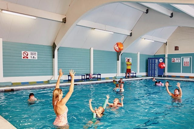 people playing with a ball in the pool