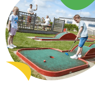 Children playing crazy golf 