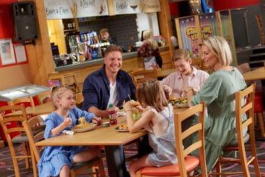 a family enjoying a meal at a restaurant