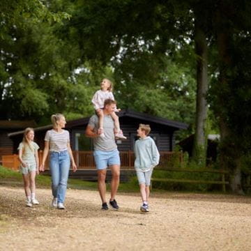 a family taking a woodland stroll