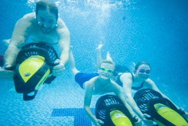 family on aqua jets underwater