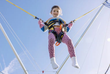 child on bungee trampoline