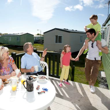 family outside a caravan