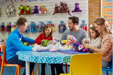 family taking part in a make a bear workshop