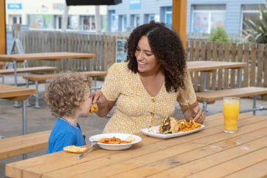 mother and child having a meal outside