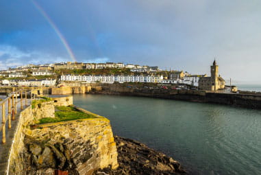 pier at Portleven with rainbow in the background