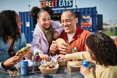 family eating food from a Street Eats van