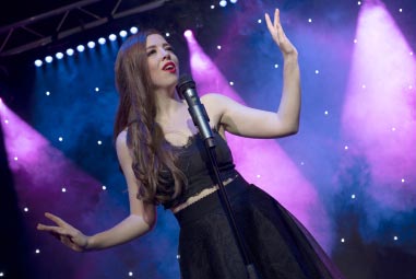 female singer performing on stage