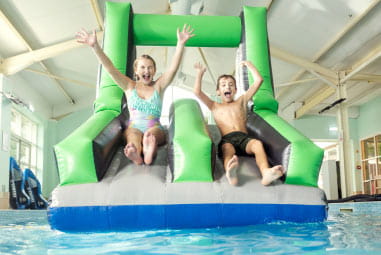 children going down a water slide