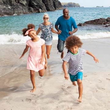 Family running on beach