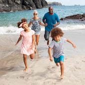 Family running on beach