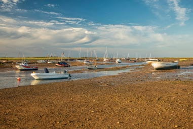 Boats in a river at low tide
