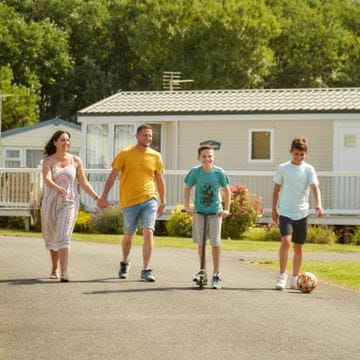 a family walking through a park dean resort