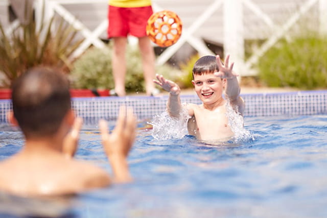 family having fun in the outdoor pool